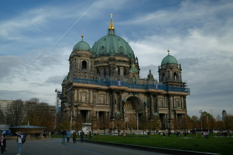 this large building has a green dome on it