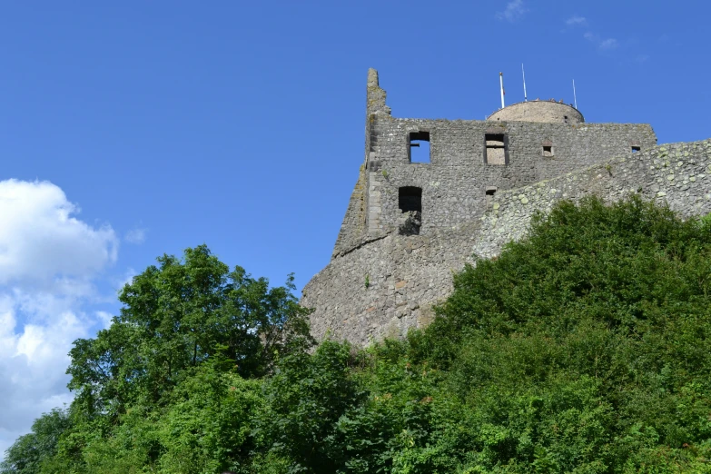 a stone tower sitting on top of a hill