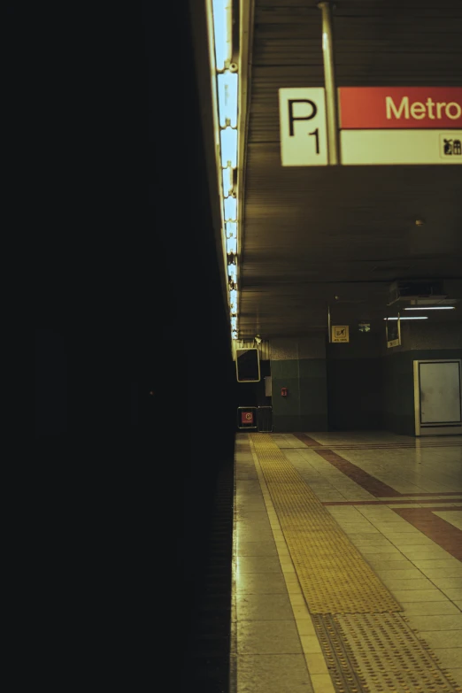 subway stop with metal panels above the walkway