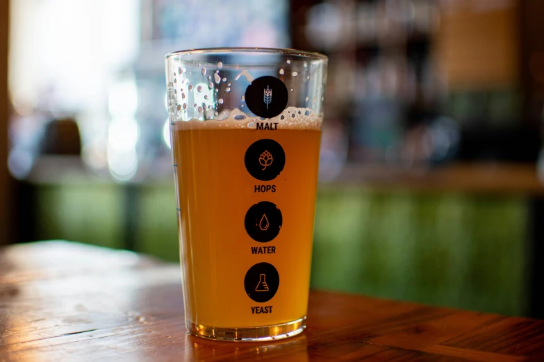 a glass that is on a wooden table