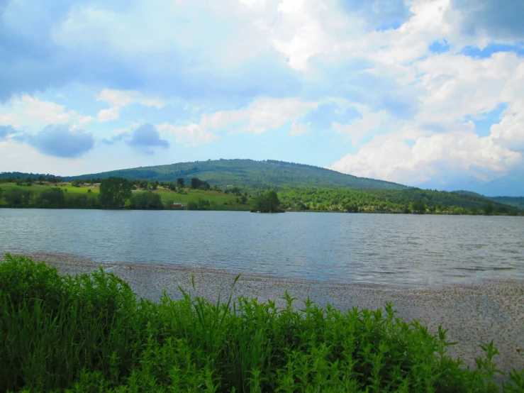 a very pretty large body of water with trees around it