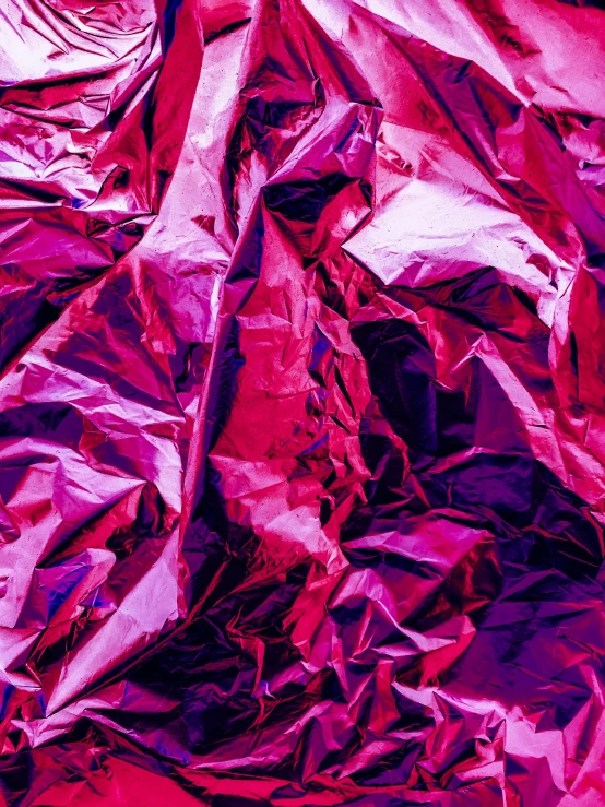 close up view of red and pink tinfoil