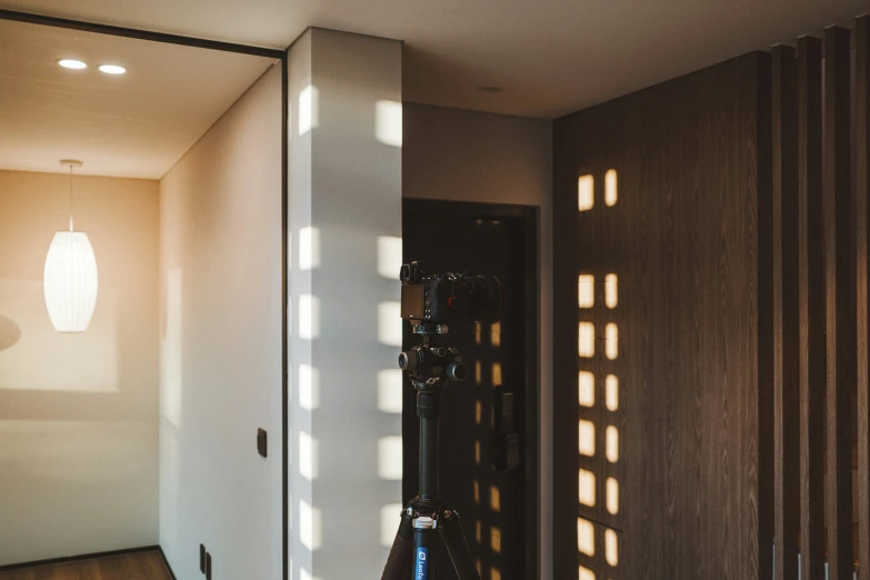 a hallway with some lights shining in the corner