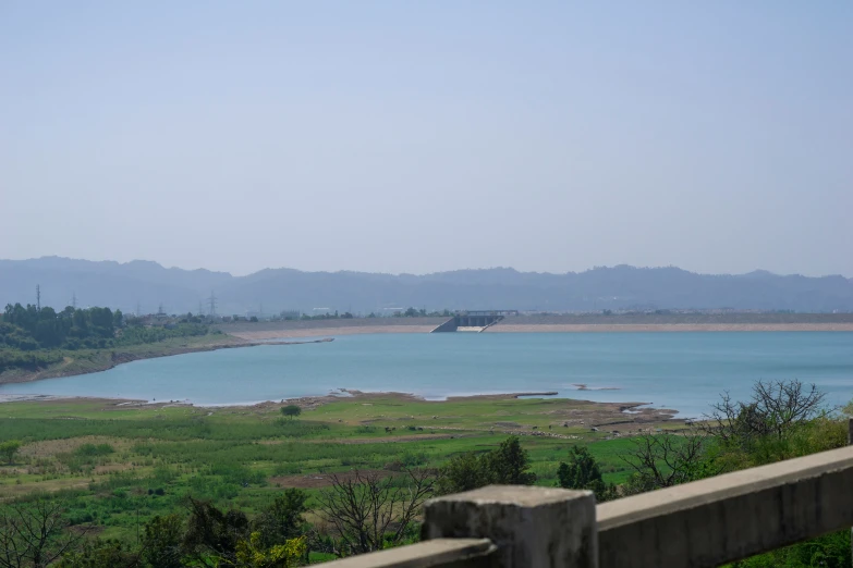 the view from a fence over a body of water