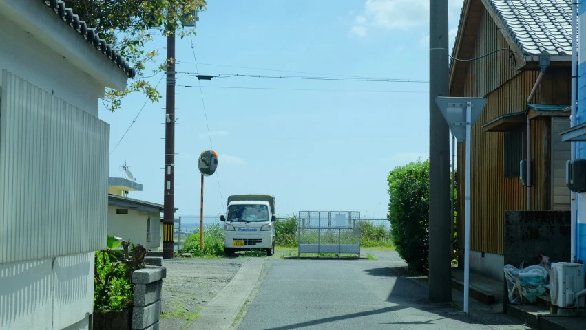 there is a truck parked in the alley