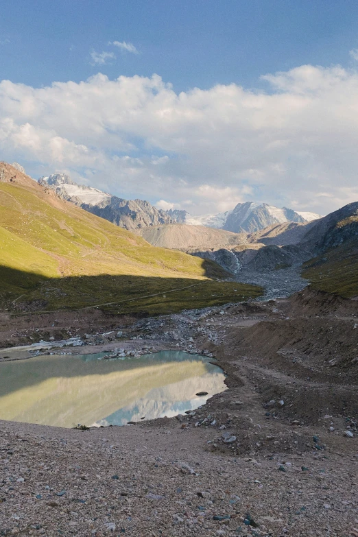 the view into a valley is amazing with mountains in the background