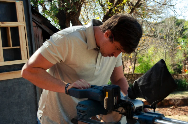 a man using a cordless drill machine