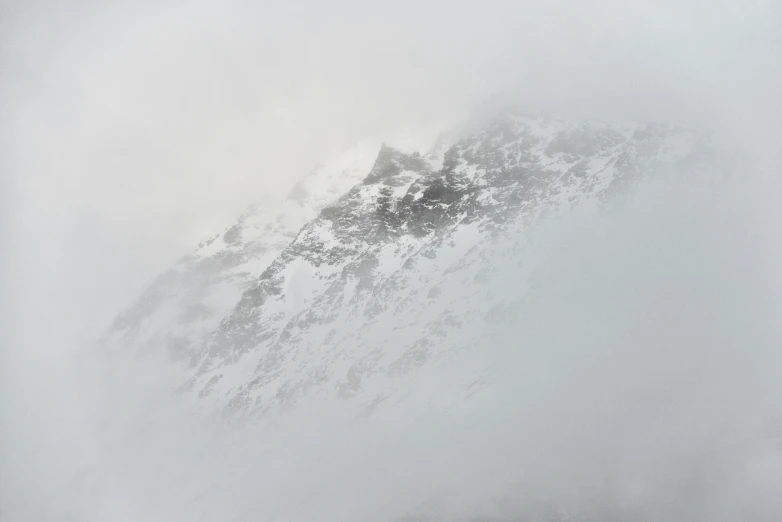 a skier is looking down the slope