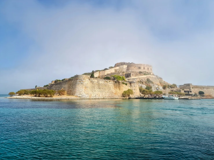 a small island is shown from the water