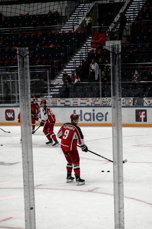 a hockey game on ice with players skating