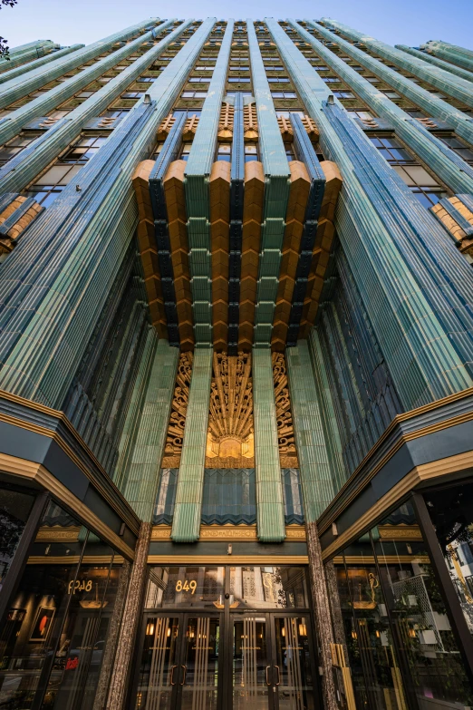 an empty building reflecting its mirrored glass front door