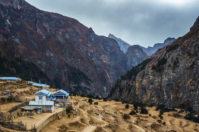 a picture of a village near the mountains