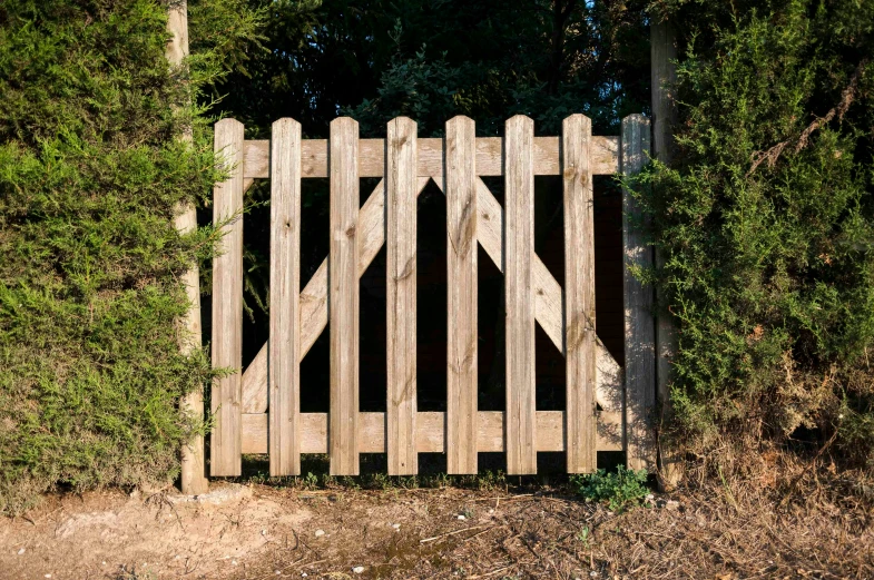 the large wooden fence has an opening at one end