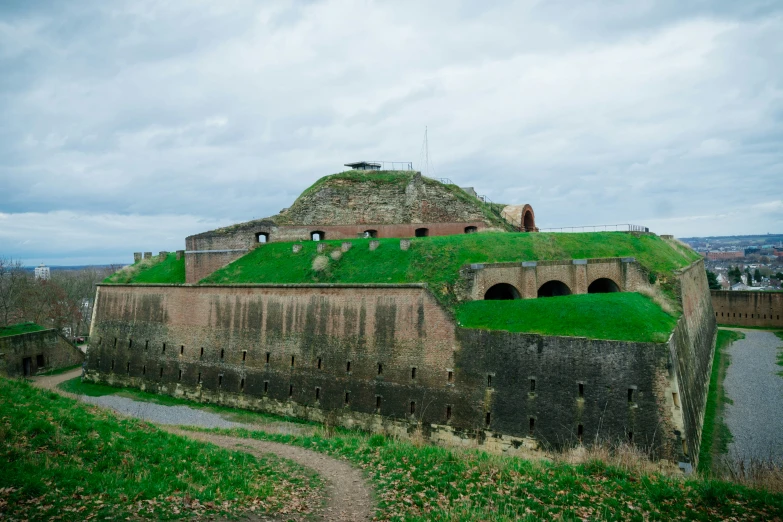 the green roof of this castle is made of bricks