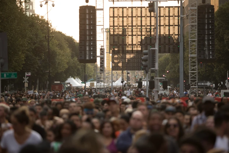 the crowd is gathered to hear a musical performance