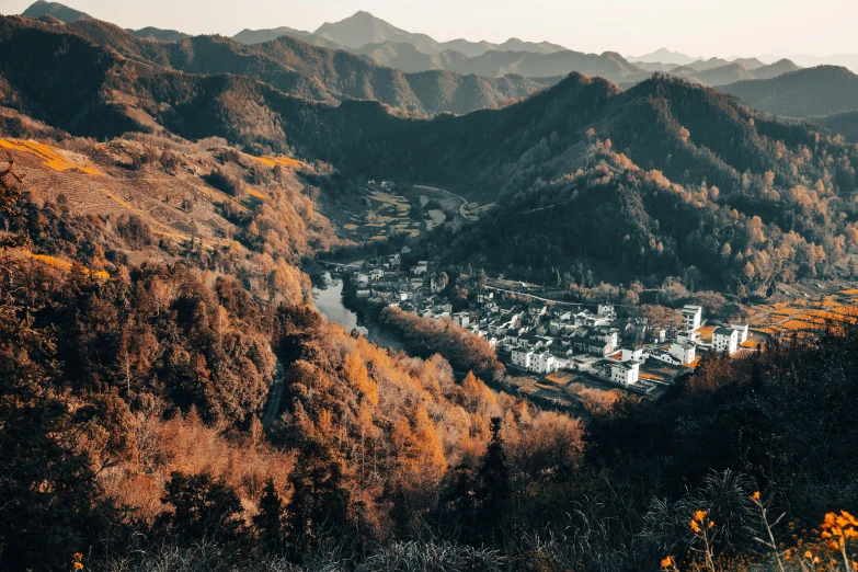 an aerial s of a city nestled in mountains