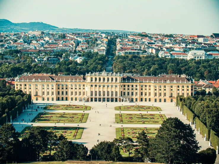 the building with the garden area in front of it has a lot of windows