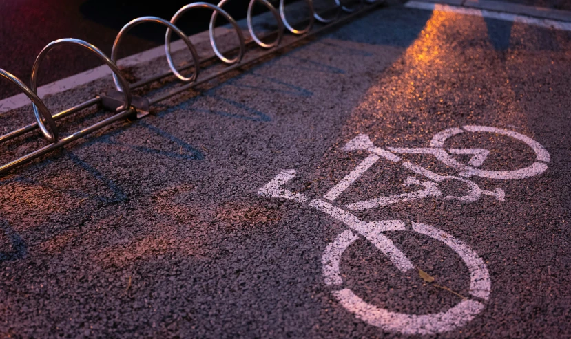 a bicycle lane marked in the ground with the number 3 on it