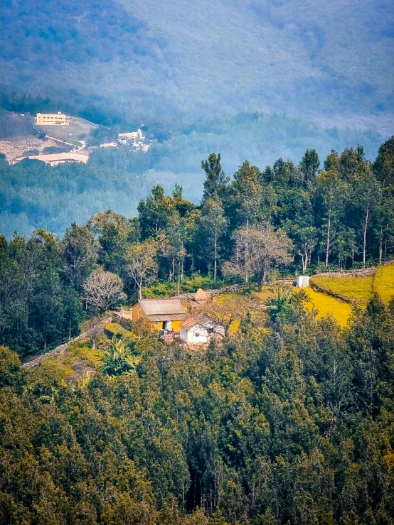 a scenic s of a green area with a mountain in the background