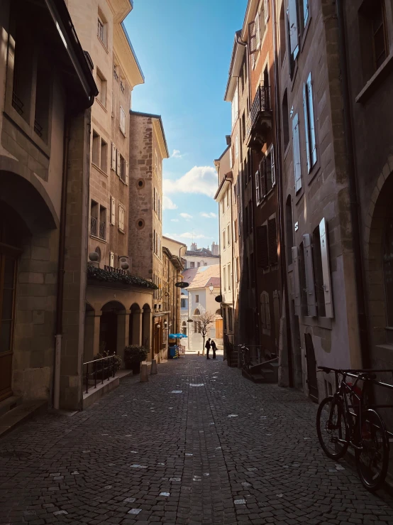 two people are on a bike in a alley