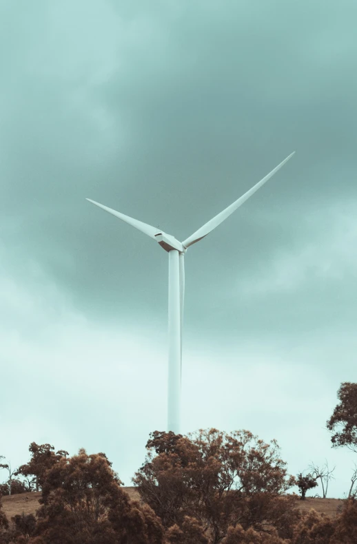 a wind turbine is in a barren area