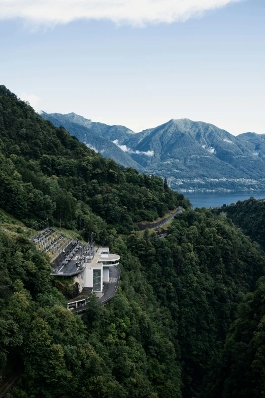 a mountain with lush green trees near it