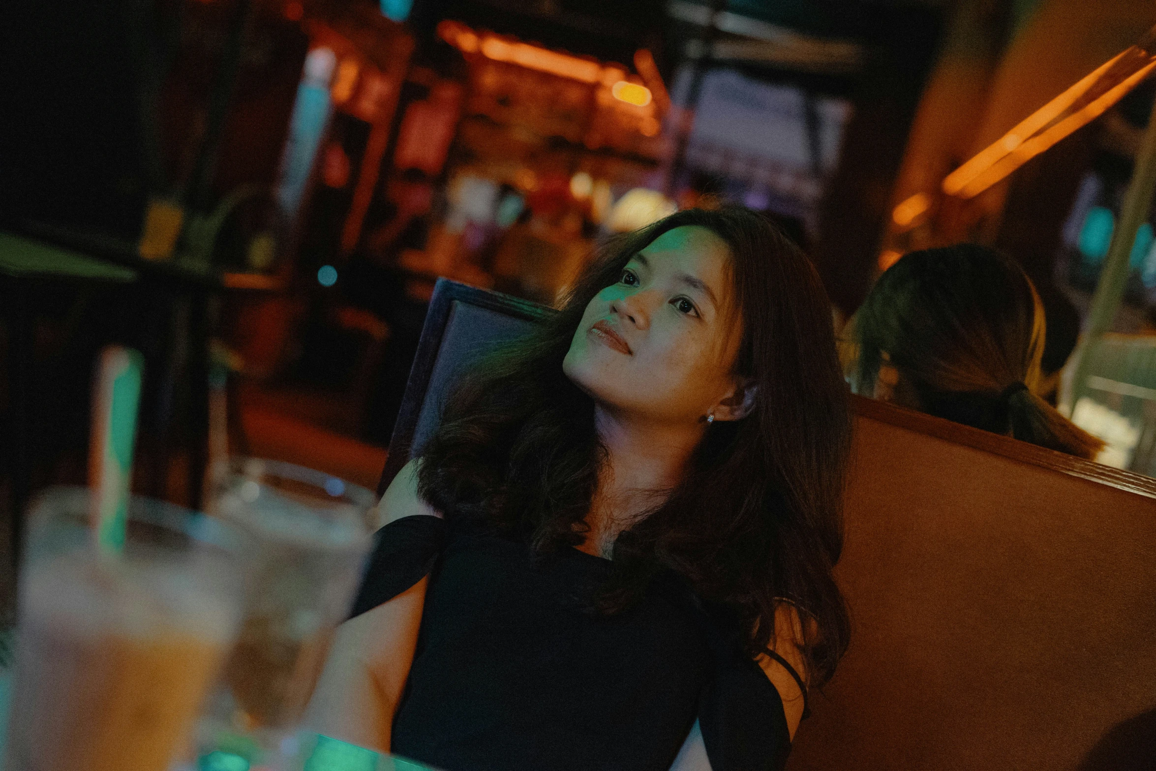 a beautiful woman sitting down at a table