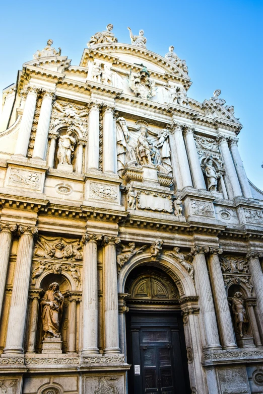 a large stone church building with a wooden door