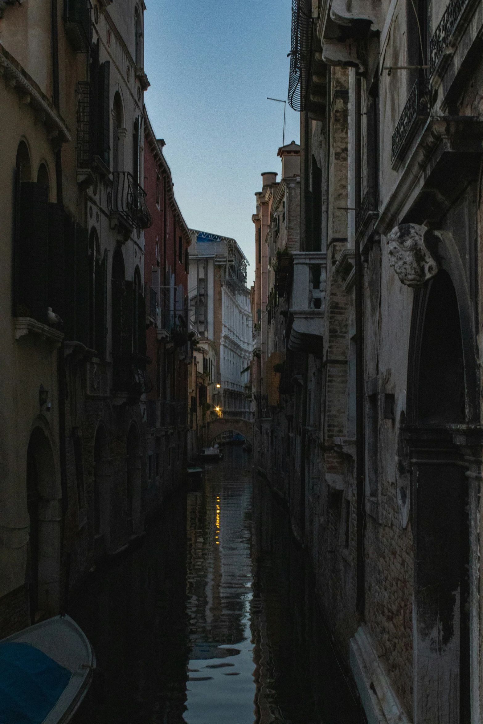 a very long narrow canal that is going down a hill