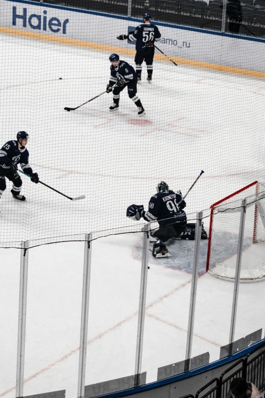 a hockey goalie with the pucker in front and the net in the back