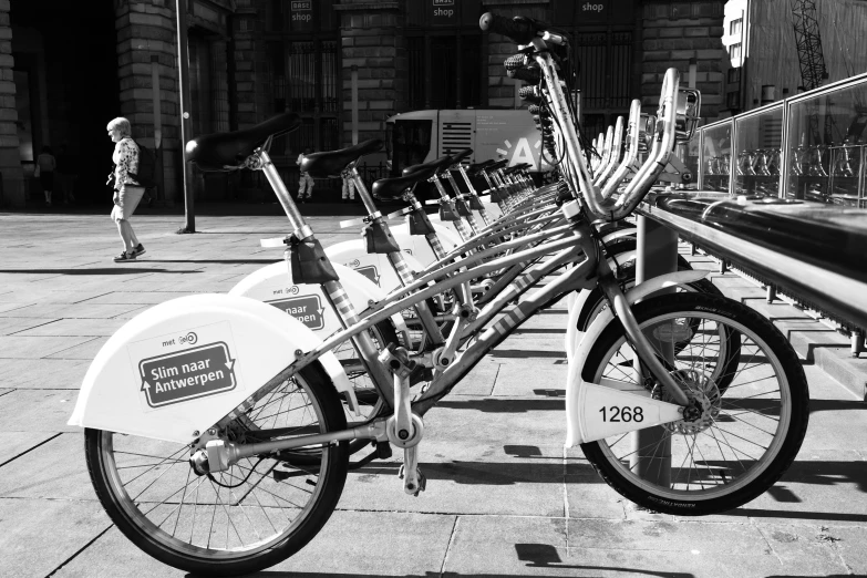 a black and white po of several bicycles parked