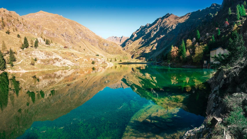 a po looking up at mountains and lake