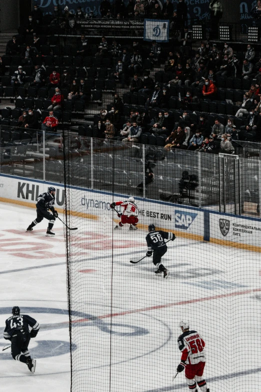 a group of players in a hockey game on the ice