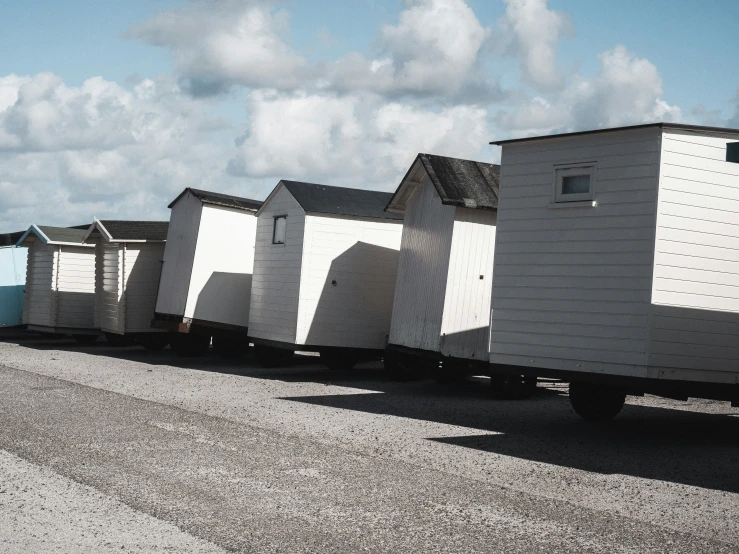 some kind of trailer with several different colored buildings