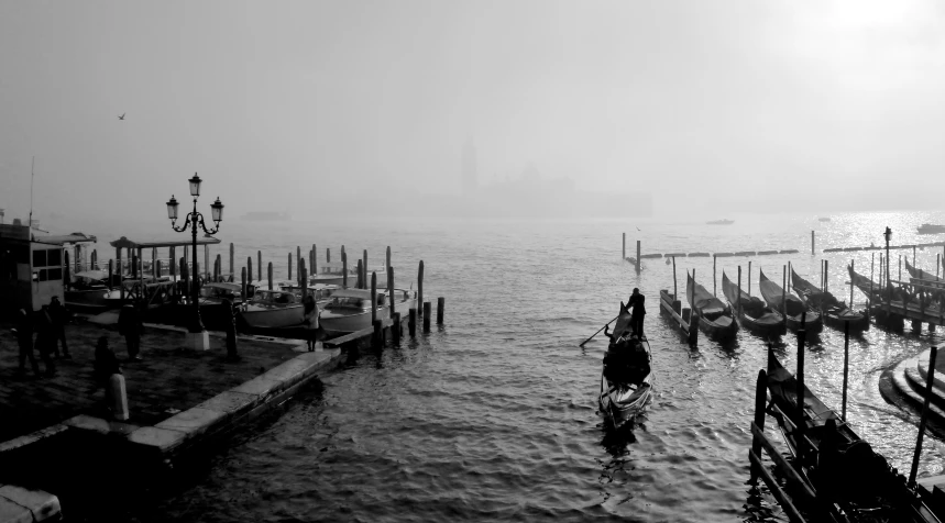 a row of boats floating in a body of water