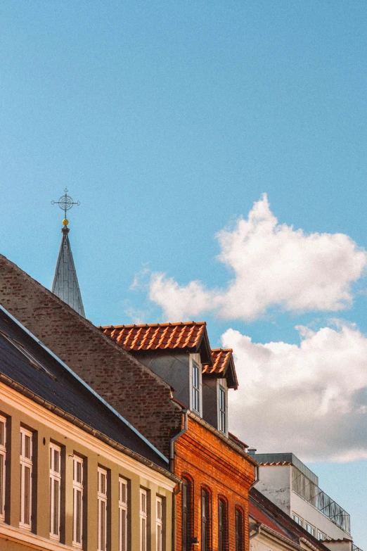 several buildings next to each other with a sky background