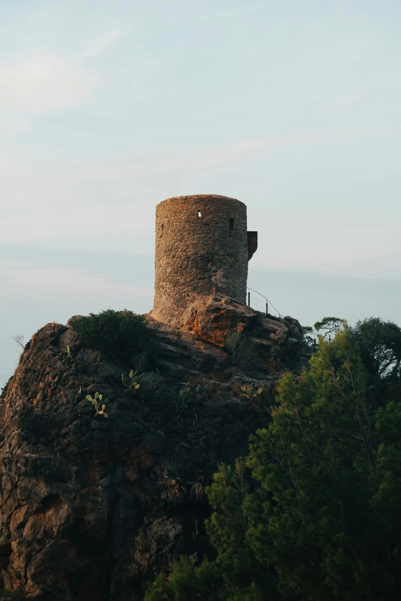 a large rock has a structure made of stones