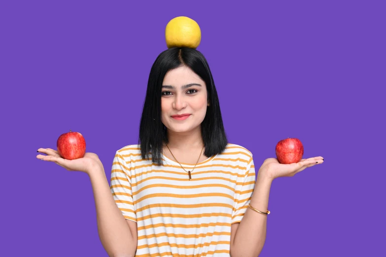 an image of a woman with apples balancing them on her head