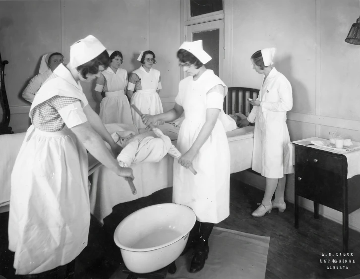 vintage hospital care team at work to carry a baby