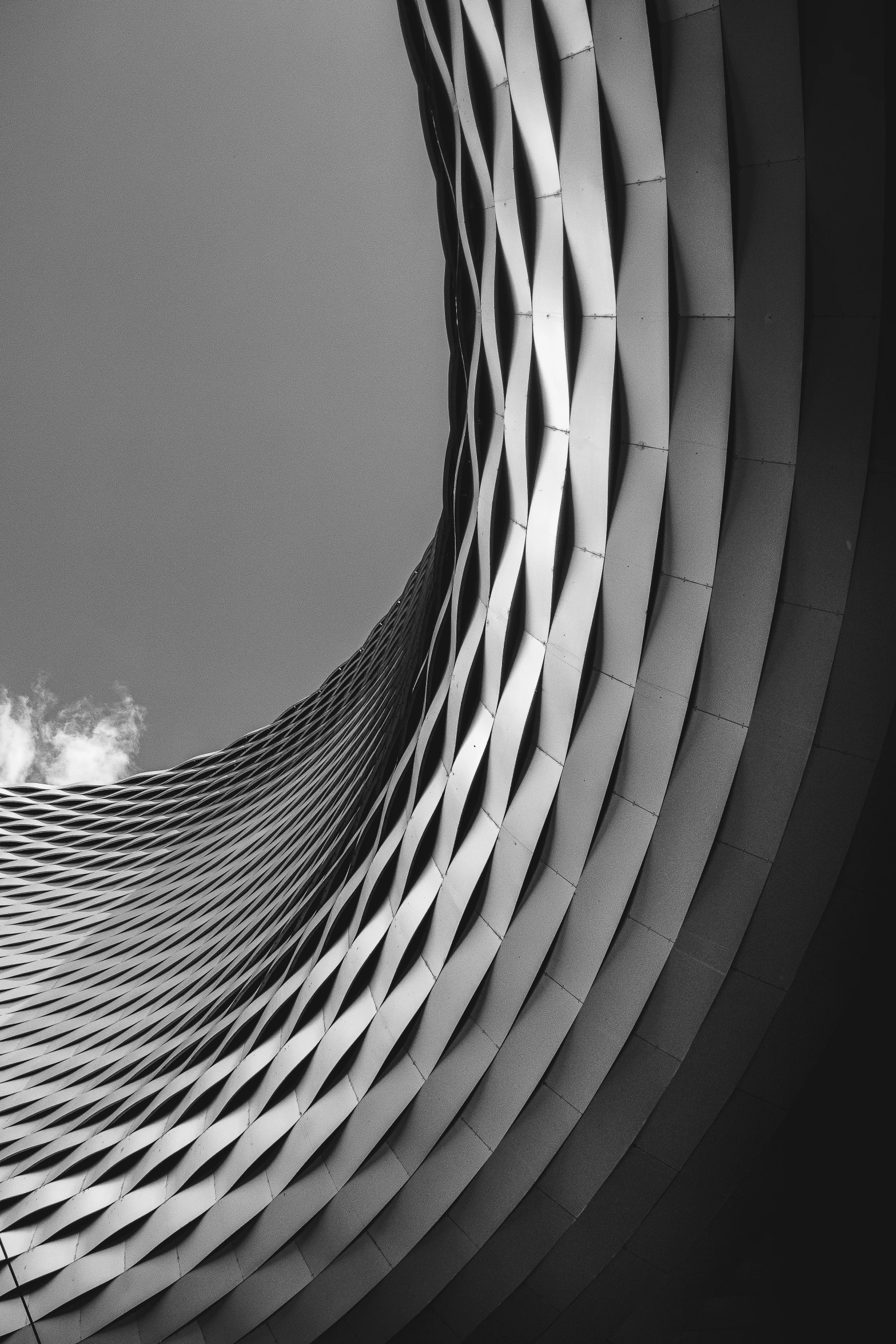 black and white architecture po of curved walkway