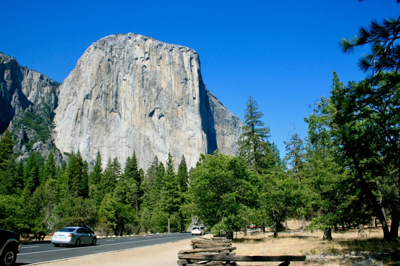 there is a very large rock face in the background