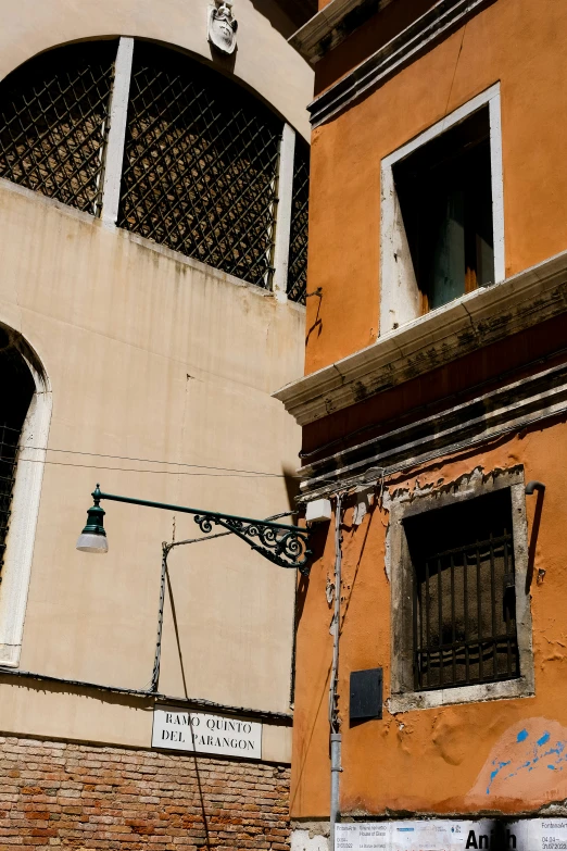 an old building with many windows and street signs