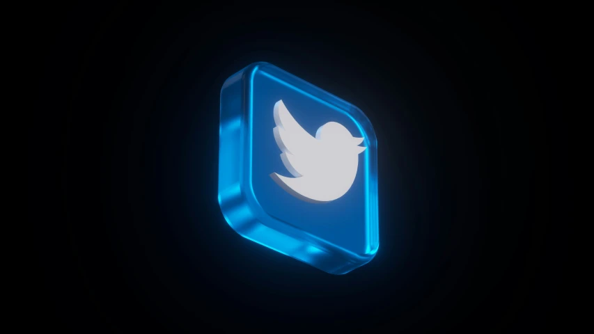 a blue twitter logo against a black background
