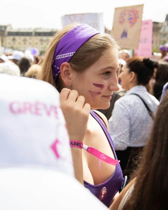 a  in purple has some pink on her face