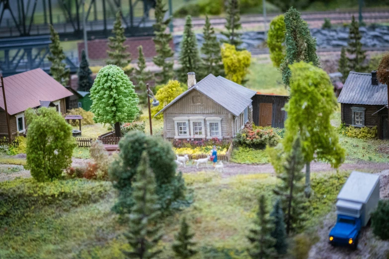 a toy village with two houses and trees