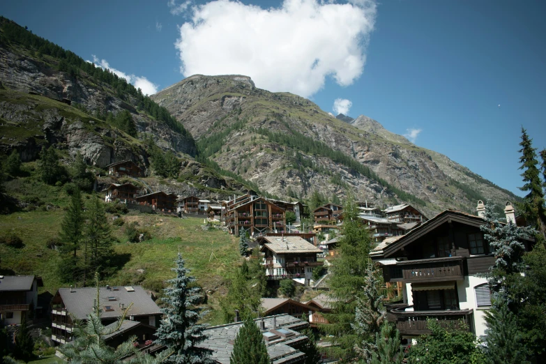 a group of houses standing in the middle of a valley