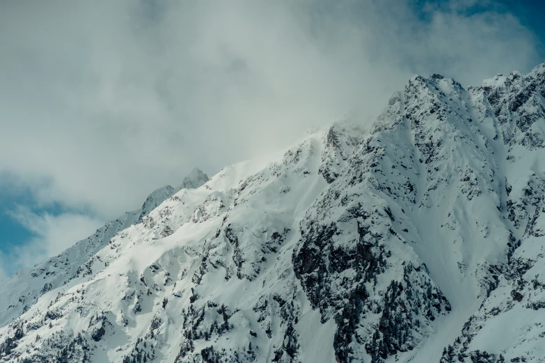 a very large snowy mountain covered in snow