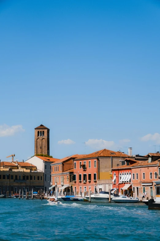 old buildings lining the waterfront in a city