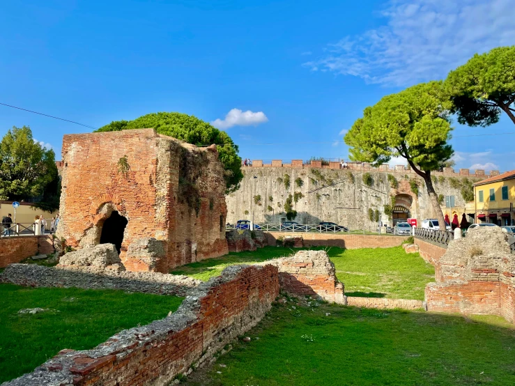 people walking around inside a castle style area