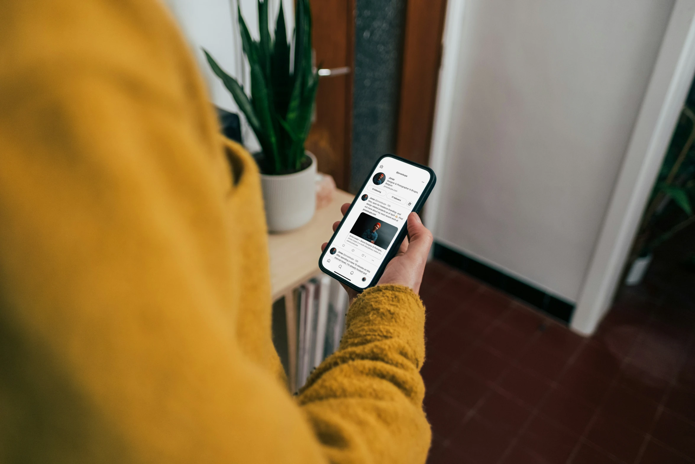 a person using an iphone on the floor